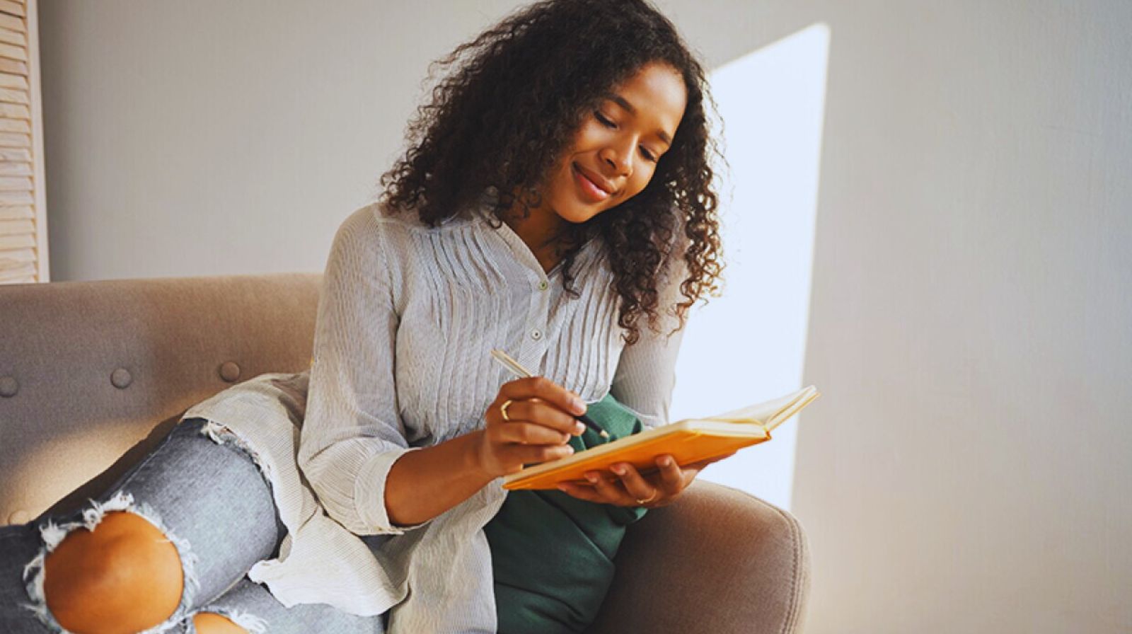 Happy woman journaling